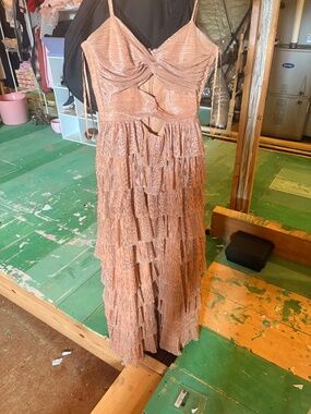 gianni bini hazel metallic dress If you're looking for a stylish and glamorous option for New Year Eve, you might want to consider the Hazel Metallic Chiffon V-Neck Long Sleeve Cut Out Dress from Gianni Bini. This